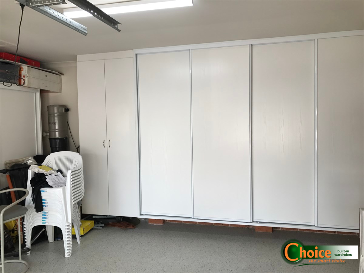 Raised Garage Storage Solution With, Garage Cabinets With Sliding Doors